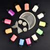 A collection of luminous glow-in-the-dark pigment powders in various colors arranged on a dark surface.