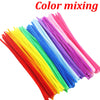 A collection of colorful chenille stem pipe cleaners in a rainbow gradient, displayed diagonally.
