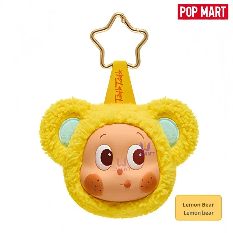 A yellow bear-shaped earbud case cover with large eyes and light blue accents.