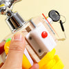 A hand holds a wooden sensory learning toy featuring a metal faucet and various components for toddlers.