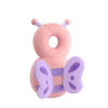 A soft pink stuffed animal shaped like a bee with purple accents.