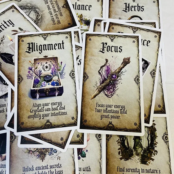 En samling tarot- eller orakelkort med titler som Alignment og Focus og mystiske illustrationer