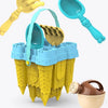 A set of yellow and blue plastic sand play accessories including a bucket, scoop, and various castle-shaped molds.