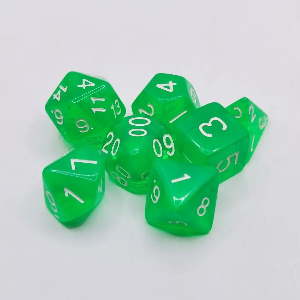 A collection of ten green acrylic polyhedral dice scattered on a white surface.