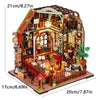 A wooden mini seaside villa dollhouse kit featuring furniture and detailed interior scenes.