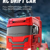 A red truck tractor RC drift car is shown driving on a road with motion blur.