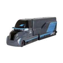 A diecast toy hauler truck modeled after a Lightning McQueen vehicle in gray and blue colors.