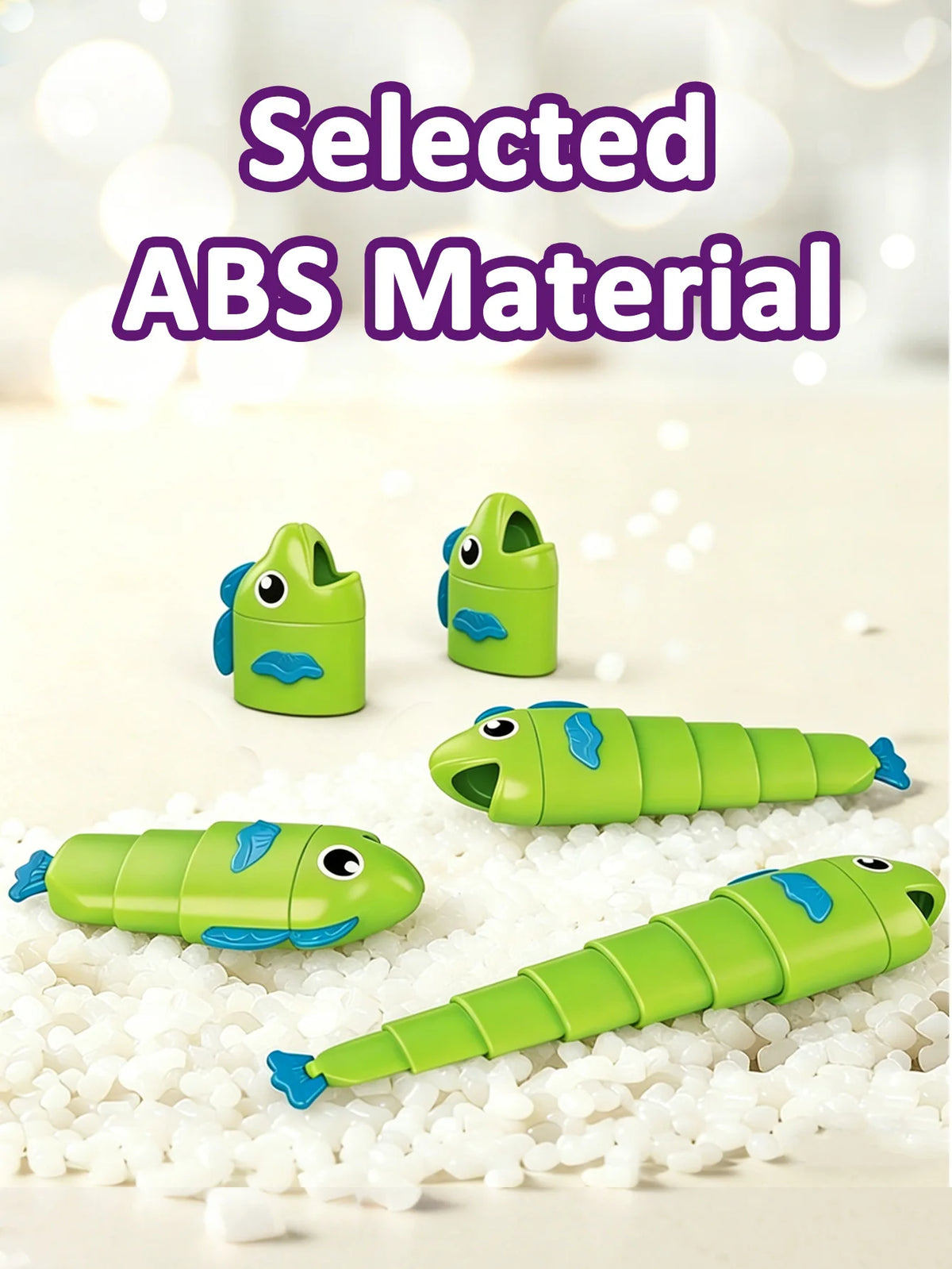 Several green plastic fish toys are displayed on a white surface with small white beads.