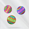Three spherical LED flying ball boomerangs showing vibrant rainbow colors and light patterns.