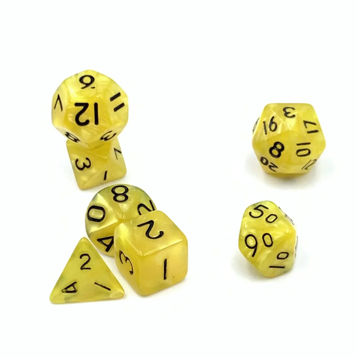 A set of seven small yellow polyhedral dice including a d10, d6, and d20.