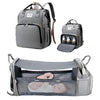 Gray multifunctional diaper bag backpack featuring a changing pad and USB port for baby care.