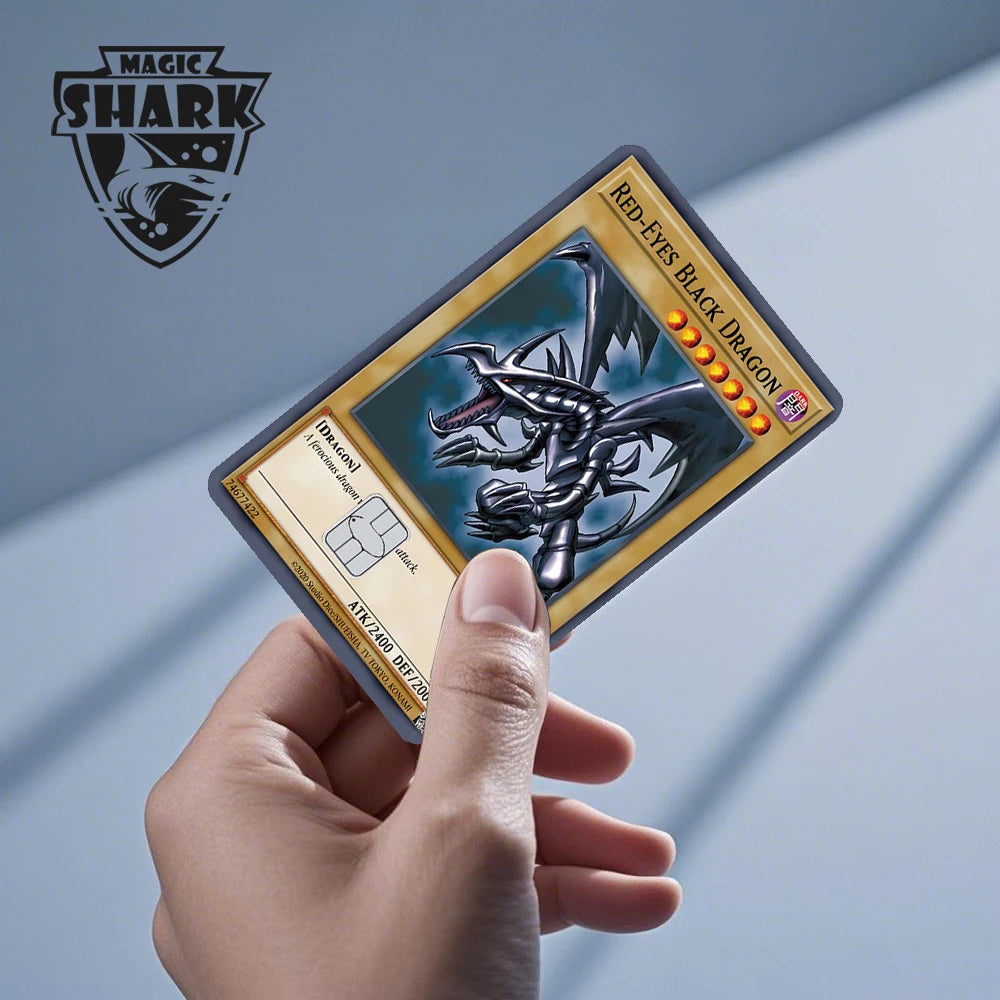 A hand holds a Magic: Shark Red-Eyes Black Dragon PVC card skin sticker displaying the dragon artwork.