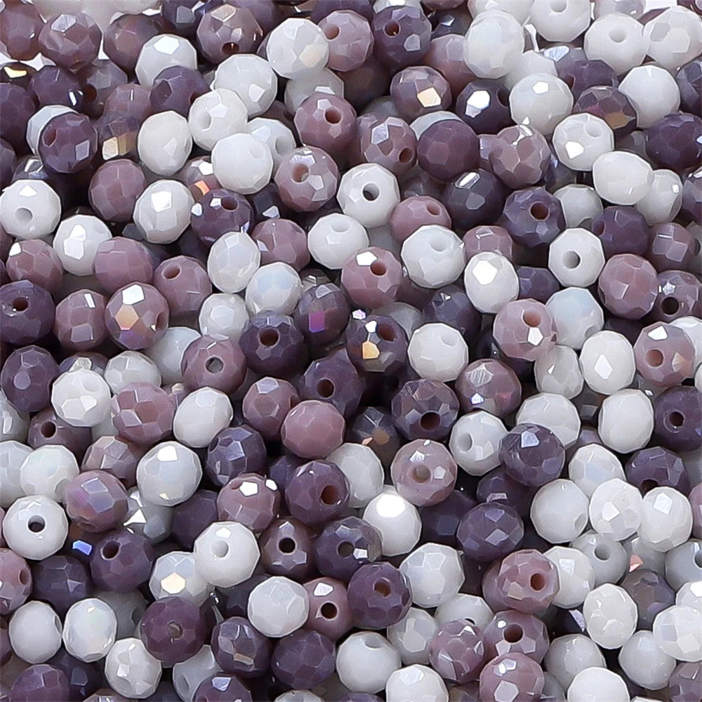 Mixed color faceted rondelle glass beads in shades of purple and white for jewelry making