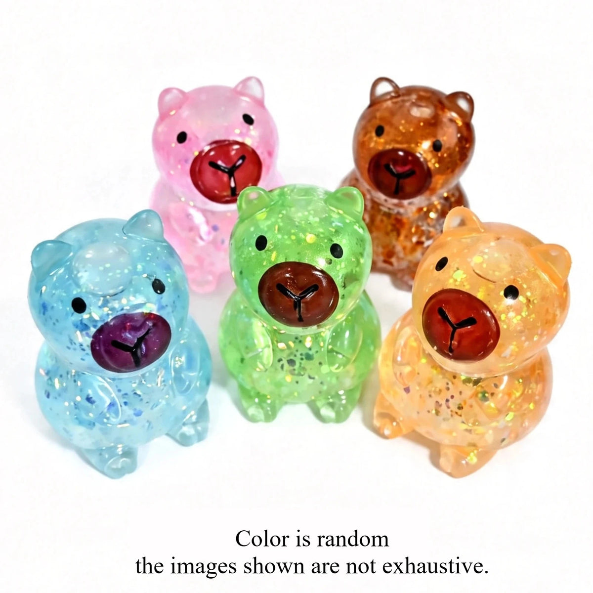A collection of five transparent glitter squishy toys shaped like animals, including a pink pig, a brown bear, a green bear, 