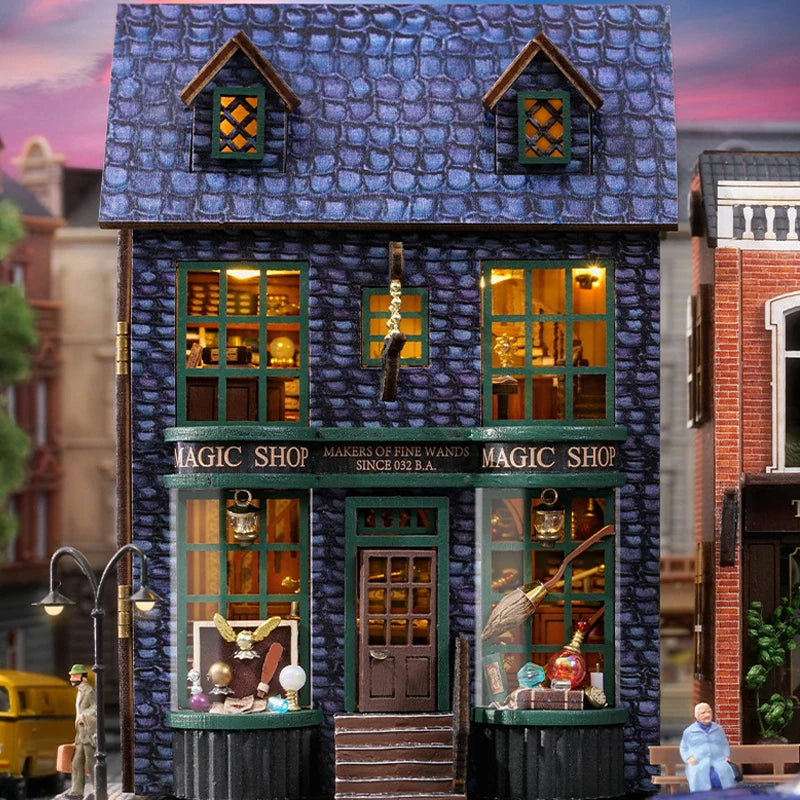 A detailed miniature wooden dollhouse kit of a pink princess villa with integrated LED lights.