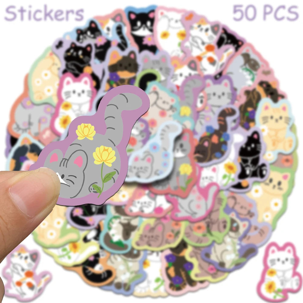 A circular arrangement of 50 cute cartoon cat stickers in various colors and styles.