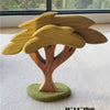 A wooden stacking block set featuring a tree design with a trunk and leaves, displayed on a light surface.