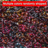 A close-up view of multiple colors of wave-patterned acrylic beads randomly shipped for jewelry making