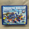 A box for a magnetic railcar building set featuring an electric track and various train components.