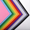 A collection of vibrant felt fabric sheets in a rainbow gradient displayed in a framed arrangement.