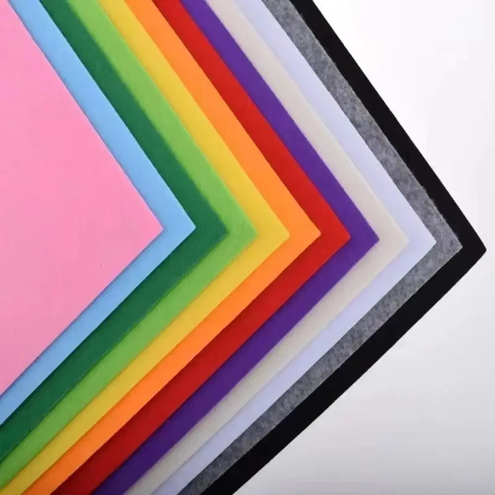 A collection of vibrant felt fabric sheets in a rainbow gradient displayed in a framed arrangement.