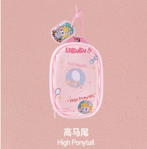 Pink fabric bag with a cute monster pendant keychain featuring a pony character