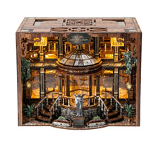 A detailed wooden miniature library model kit featuring shelves, stairs, and a statue under warm LED lighting.