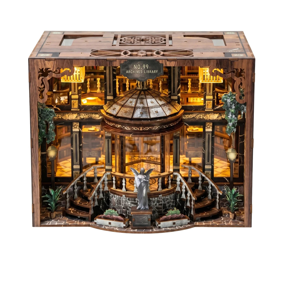 A detailed wooden miniature library model kit featuring shelves, stairs, and a statue under warm LED lighting.