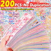 A hand holds a fan of colorful kawaii cartoon stickers for DIY crafts and journaling