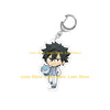 Chibi acrylic keychain of a male character with spiky black hair wearing a suit and holding a blue flower.