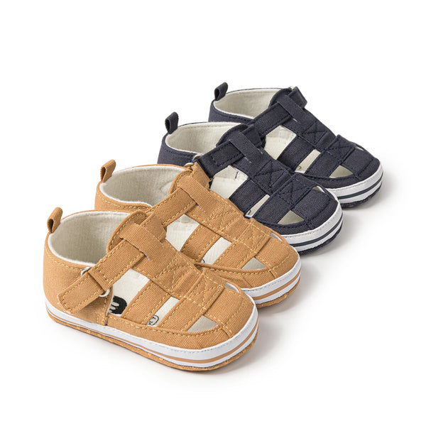 A pair of tan breathable canvas sandals for baby and toddler, shown in a light brown color.