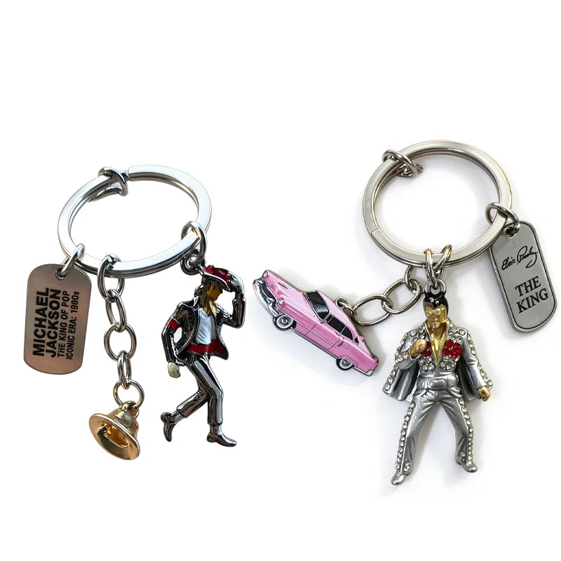 A keychain featuring a figurine of Michael Jackson in a suit and a pink car.