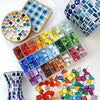 A collection of 300 mosaic glass tiles in various colors and shades arranged in a plastic tray.