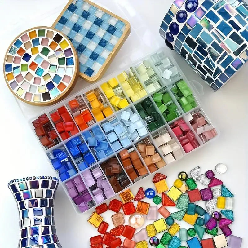 A collection of 300 mosaic glass tiles in various colors and shades arranged in a plastic tray.