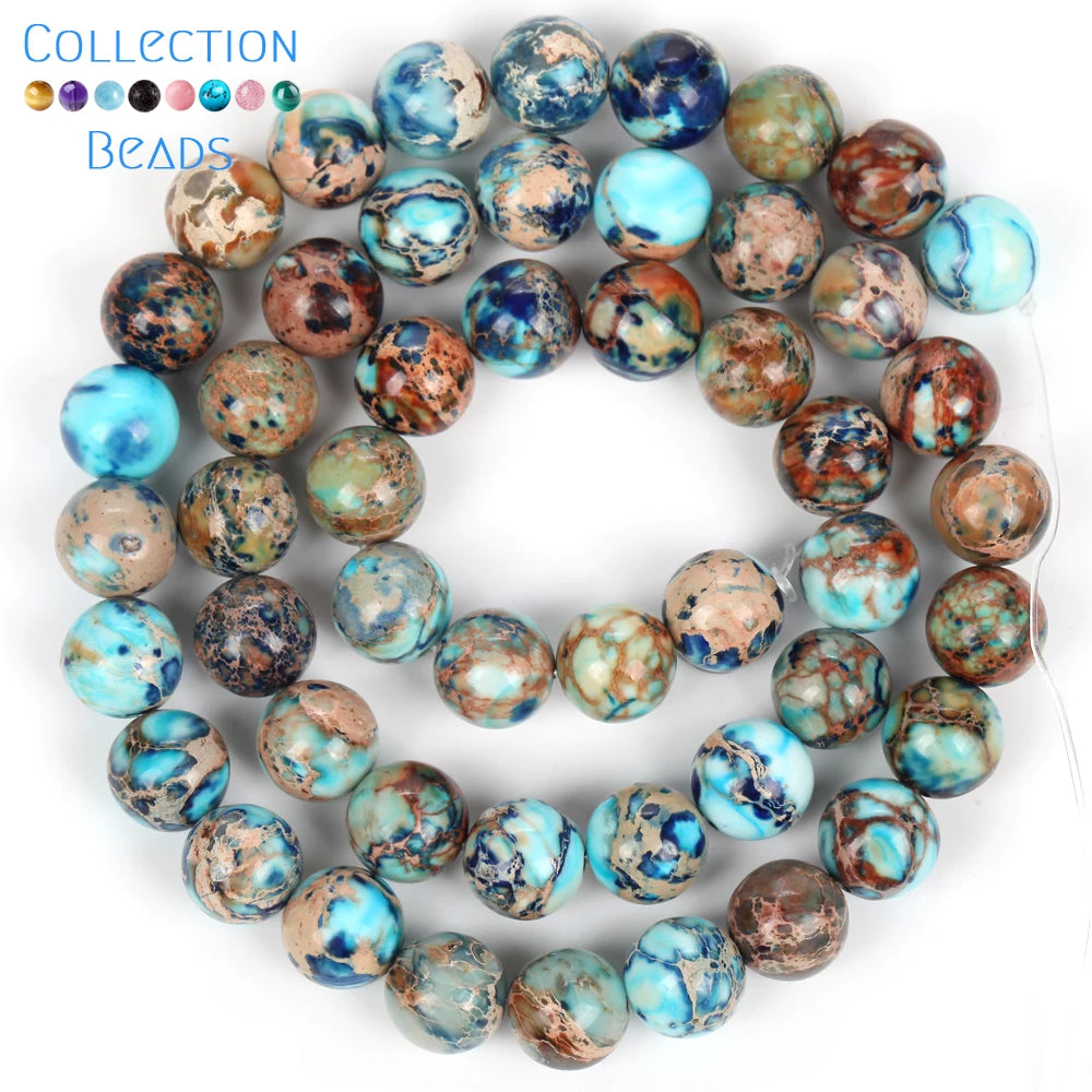 A collection of natural sea sediment jasper and turquoise beads for jewelry making, displayed on a white background.