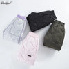 A collection of black, gray, and pink waterproof winter pants with fleece lining displayed on a white background.