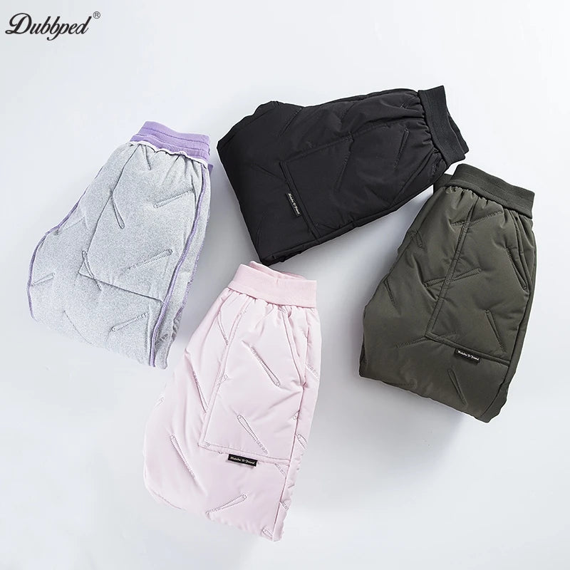 A collection of black, gray, and pink waterproof winter pants with fleece lining displayed on a white background.