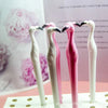Three pink and white toucan-shaped diamond painting tools displayed on a white surface.