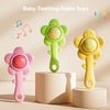 Three colorful silicone teething rattle toys in pink, green, and yellow are displayed on a light background.