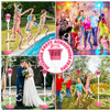 Outdoor party atmosphere props showing people playing with bubble machines and a woman in a white dress.