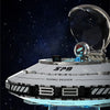 A clear glass dome model of an alien spaceship built from LEGO-style blocks against a dark starry background.