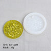 A yellow silicone resin mold set featuring heart, round, oval, and rectangle shapes displayed on a light gray cloth.