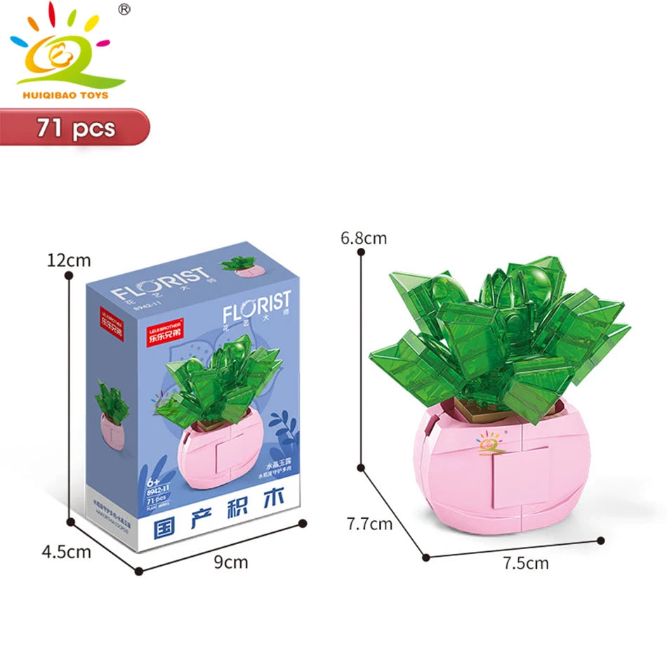 A pink ceramic planter containing a green succulent plant, packaged with DIY flower building blocks.