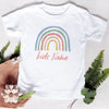 White t-shirt featuring a rainbow arch design and the text Kids Name printed in pink.