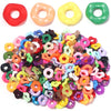 Assortment of colorful acrylic spacer beads in various shapes and colors