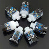 A set of seven floral resin potion bottles shaped like polyhedral dice, featuring numbers 1 through 12.