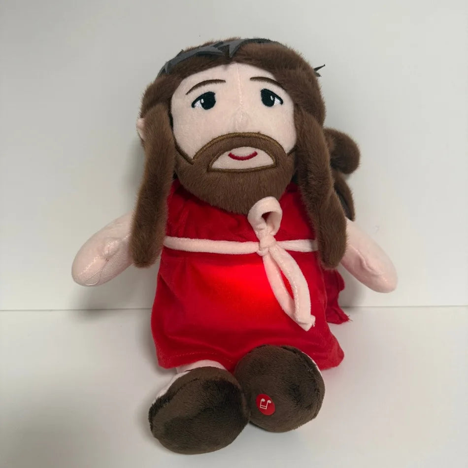 A plush doll resembling Jesus with long brown hair and a beard wearing a red garment.
