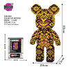 A yellow and black patterned bear figure made of micro building blocks.