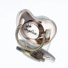 A personalized rhinestone baby pacifier featuring a crown design and the name Angelica set in a pink silicone mold.