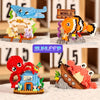 Building blocks set featuring an orange shark, red crab, and yellow clownfish ocean animals.